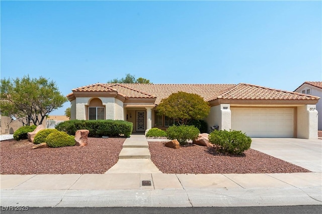 3016 Lotus Hill Dr, Las Vegas, NV 89134 - mediterranean / spanish house with an attached garage, concrete driveway, and stucco siding