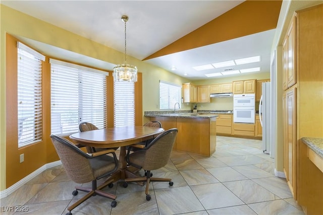 3016 Lotus Hill Dr, Las Vegas, NV 89134 - dining area with lofted ceiling, a chandelier, and light tile patterned flooring