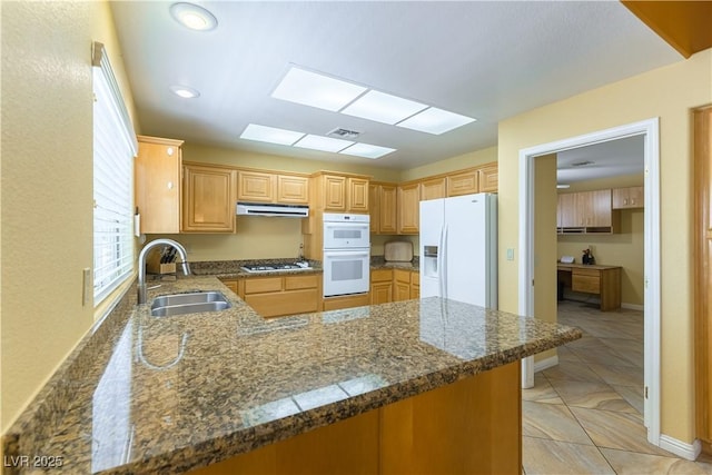 3016 Lotus Hill Dr, Las Vegas, NV 89134 - kitchen featuring white appliances, a peninsula, under cabinet range hood, and recessed lighting