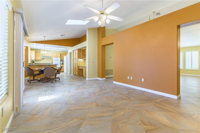 3016 Lotus Hill Dr, Las Vegas, NV 89134 - living area with lofted ceiling, a ceiling fan, and a skylight