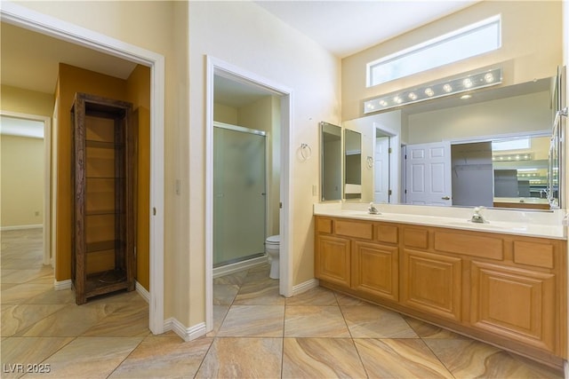 3016 Lotus Hill Dr, Las Vegas, NV 89134 - bathroom with double vanity, a stall shower, and a spacious closet
