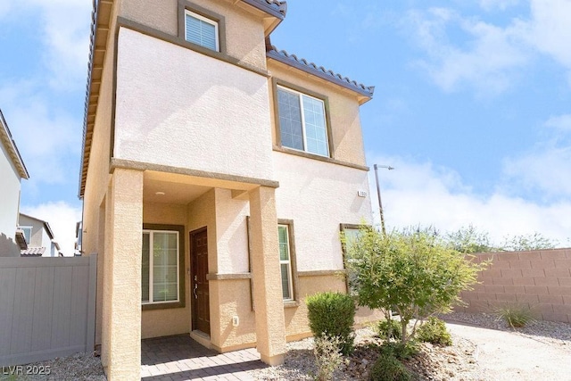7331 Sunray Point St, North Las Vegas, NV 89084 - rear view of house featuring stucco siding and a tile roof