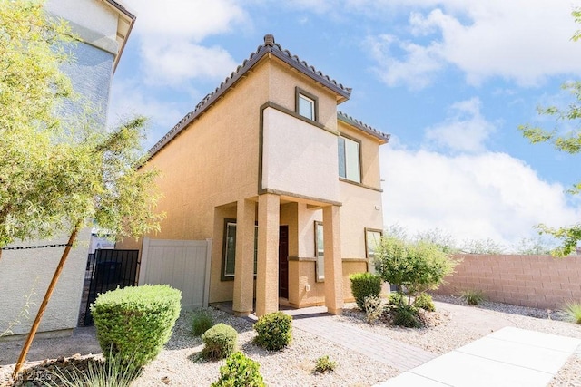 7331 Sunray Point St, North Las Vegas, NV 89084 - view of front of home with a tiled roof and stucco siding