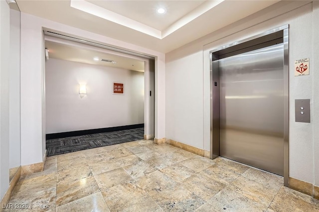 87 E Agate Ave Unit 208, Las Vegas, NV 89123 - hall featuring stone tile floors and elevator