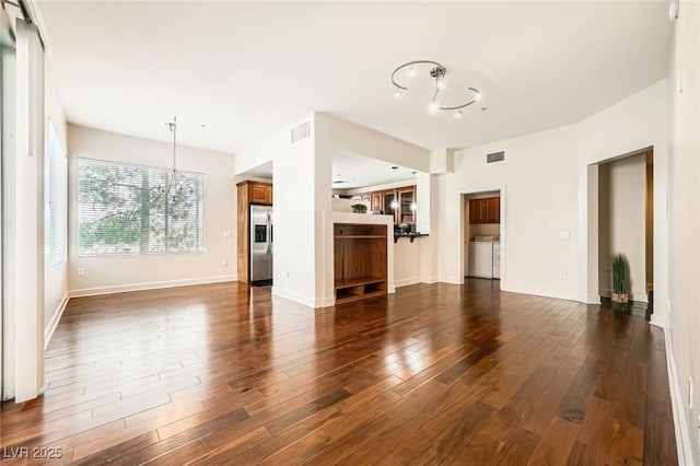 87 E Agate Ave Unit 208, Las Vegas, NV 89123 - unfurnished living room featuring a chandelier and dark wood-style floors