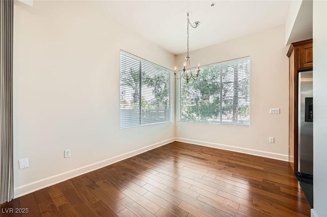 87 E Agate Ave Unit 208, Las Vegas, NV 89123 - unfurnished dining area featuring a chandelier and dark wood-style floors