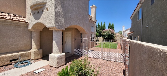 9204 Vosburgh Dr, Las Vegas, NV 89117 - view of property exterior featuring stucco siding and a gate