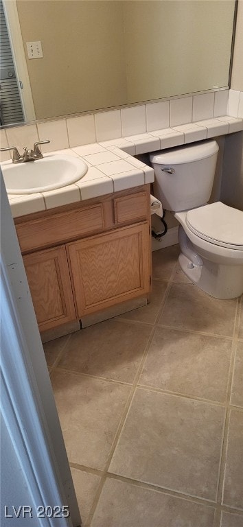 9204 Vosburgh Dr, Las Vegas, NV 89117 - bathroom with vanity and tile patterned floors