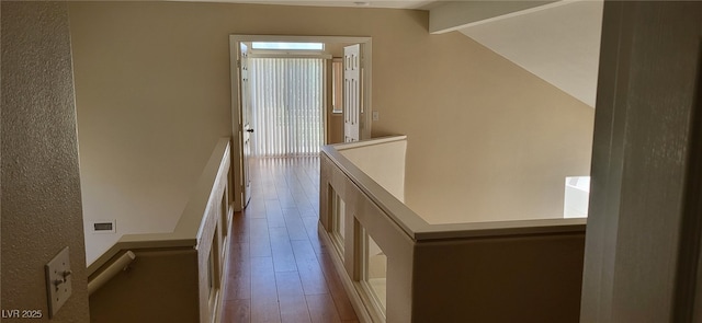 9204 Vosburgh Dr, Las Vegas, NV 89117 - corridor featuring an upstairs landing, wood finished floors, plenty of natural light, and vaulted ceiling