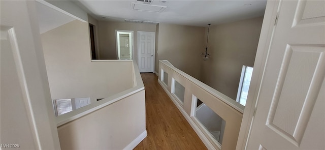 9204 Vosburgh Dr, Las Vegas, NV 89117 - corridor with an upstairs landing and wood finished floors