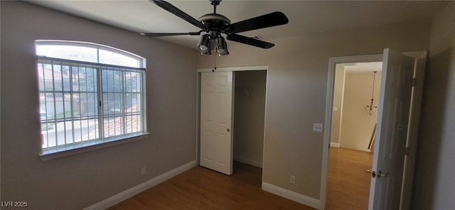 9204 Vosburgh Dr, Las Vegas, NV 89117 - unfurnished bedroom with wood finished floors, a closet, and a ceiling fan