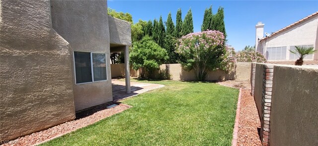 9204 Vosburgh Dr, Las Vegas, NV 89117 - fenced backyard featuring a patio area