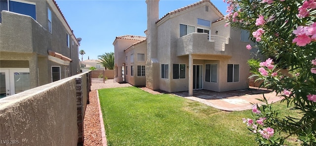 9204 Vosburgh Dr, Las Vegas, NV 89117 - back of property featuring stucco siding, a patio area, a fenced backyard, a tile roof, and a chimney