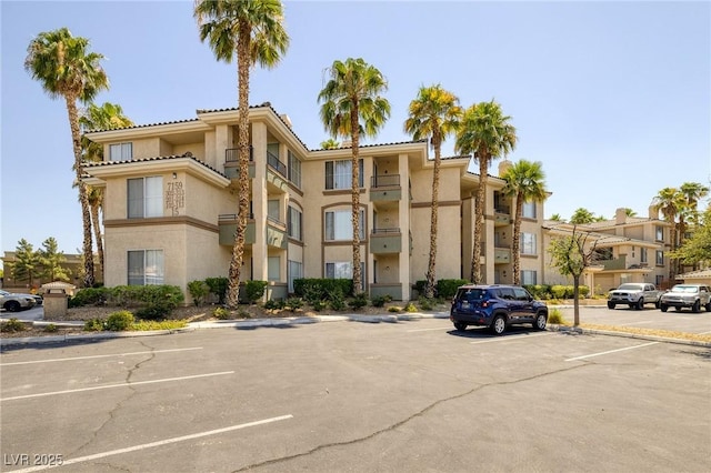 7159 S Durango Dr Unit 310, Las Vegas, NV 89113 - view of building exterior with uncovered parking