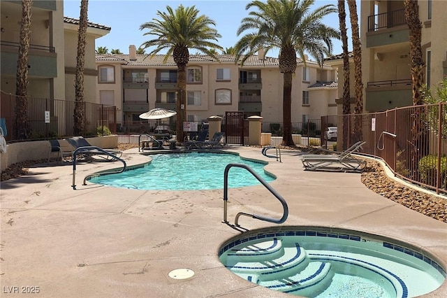 7159 S Durango Dr Unit 310, Las Vegas, NV 89113 - community pool featuring a community hot tub and a patio area