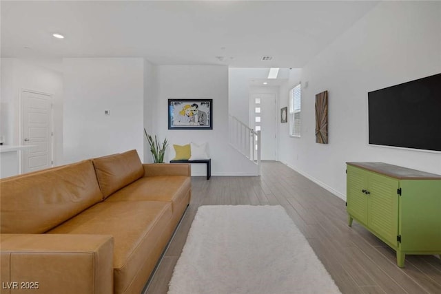 9827 Mojave Mountain St, Las Vegas, NV 89166 - living room featuring wood finished floors, recessed lighting, and stairway