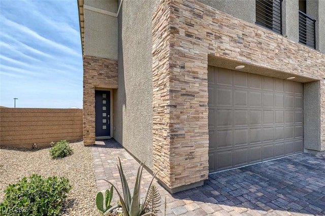 9827 Mojave Mountain St, Las Vegas, NV 89166 - view of exterior entry with stone siding and stucco siding