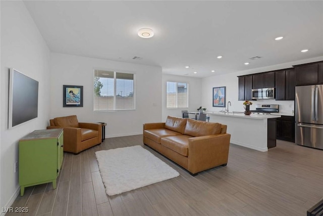9827 Mojave Mountain St, Las Vegas, NV 89166 - living area with wood finished floors and recessed lighting