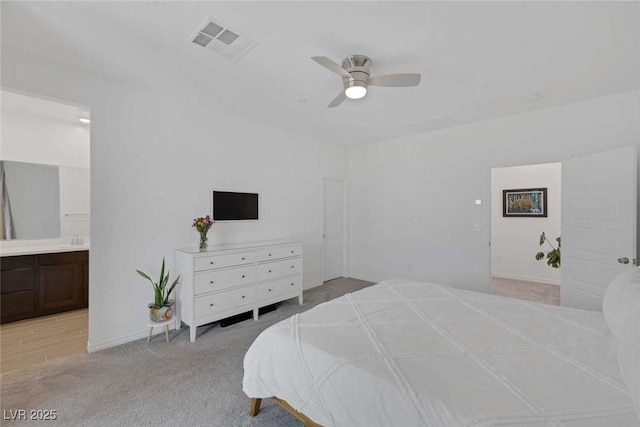 9827 Mojave Mountain St, Las Vegas, NV 89166 - bedroom with light colored carpet, ensuite bathroom, and a ceiling fan