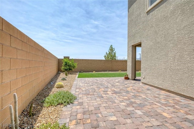 9827 Mojave Mountain St, Las Vegas, NV 89166 - fenced backyard with a patio area