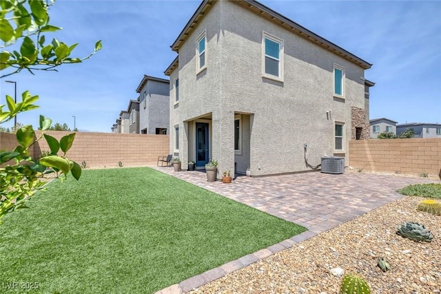 9827 Mojave Mountain St, Las Vegas, NV 89166 - back of property with stucco siding, a fenced backyard, and a patio