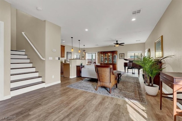 9916 Fallowdeer Ct, Las Vegas, NV 89149 - living room featuring wood finished floors, a ceiling fan, recessed lighting, and stairway