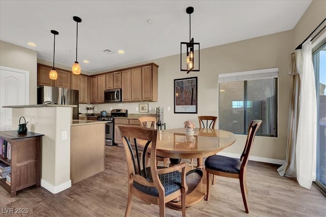 9916 Fallowdeer Ct, Las Vegas, NV 89149 - dining space with light wood finished floors and recessed lighting