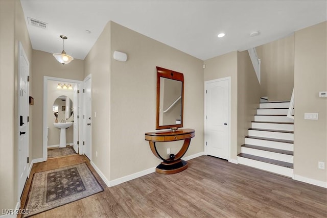9916 Fallowdeer Ct, Las Vegas, NV 89149 - entrance foyer featuring wood finished floors and stairs