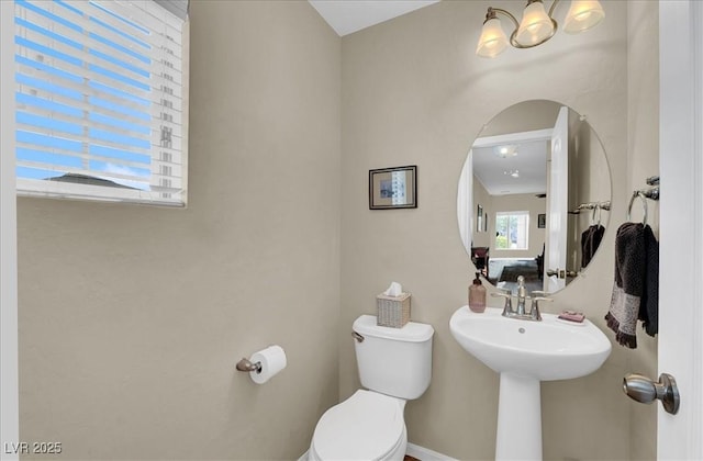 9916 Fallowdeer Ct, Las Vegas, NV 89149 - bathroom with toilet and a chandelier