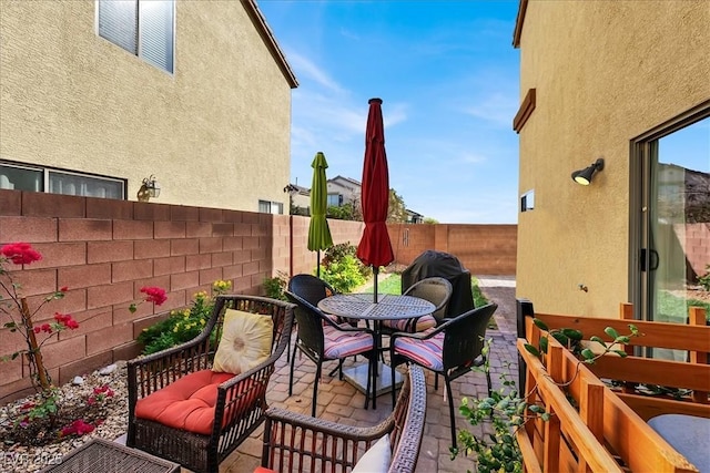 9916 Fallowdeer Ct, Las Vegas, NV 89149 - fenced backyard with a patio, outdoor dining area, and grilling area