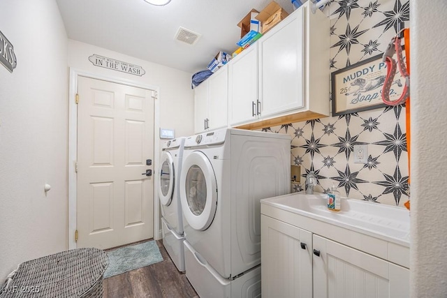 7824 Indian Cloud Ave, Las Vegas, NV 89129 - laundry room with cabinet space, separate washer and dryer, and dark wood finished floors