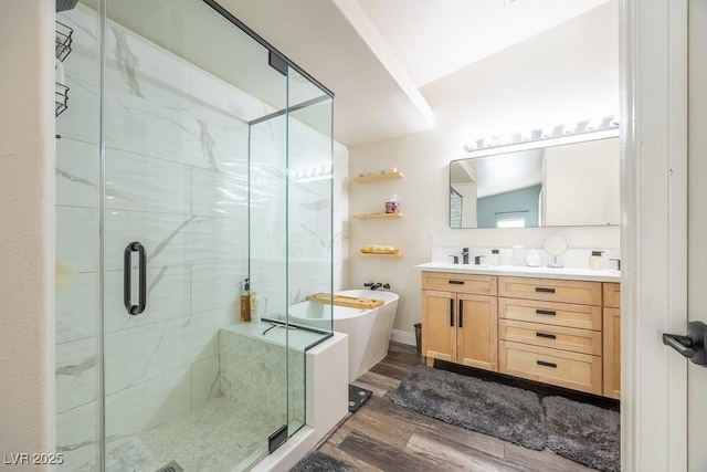 7824 Indian Cloud Ave, Las Vegas, NV 89129 - bathroom featuring a freestanding tub, double vanity, wood finished floors, and a stall shower