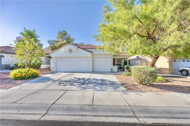 7824 Indian Cloud Ave, Las Vegas, NV 89129 - view of front facade featuring a garage, stucco siding, driveway, and a tiled roof