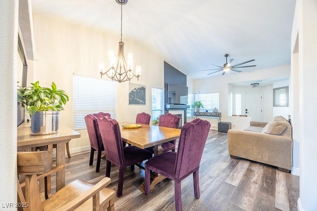 7824 Indian Cloud Ave, Las Vegas, NV 89129 - dining room with a chandelier, wood finished floors, plenty of natural light, and vaulted ceiling