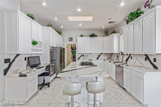 60 N Fogg St, Las Vegas, NV 89110 - kitchen with decorative backsplash, white cabinets, light marble finish flooring, and recessed lighting