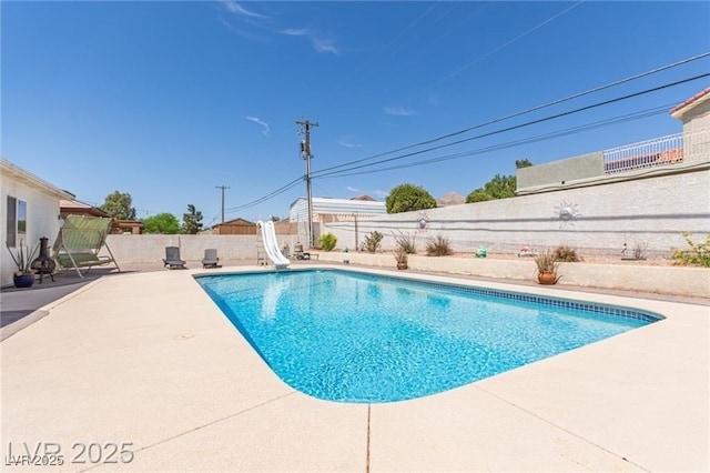 60 N Fogg St, Las Vegas, NV 89110 - view of pool featuring a water slide, a fenced backyard, and a patio area