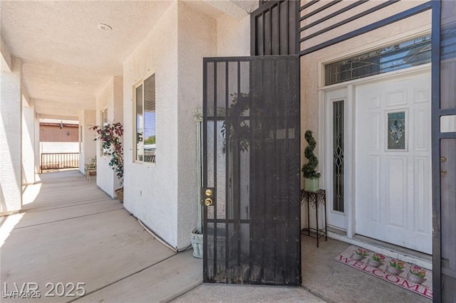 60 N Fogg St, Las Vegas, NV 89110 - doorway to property with stucco siding