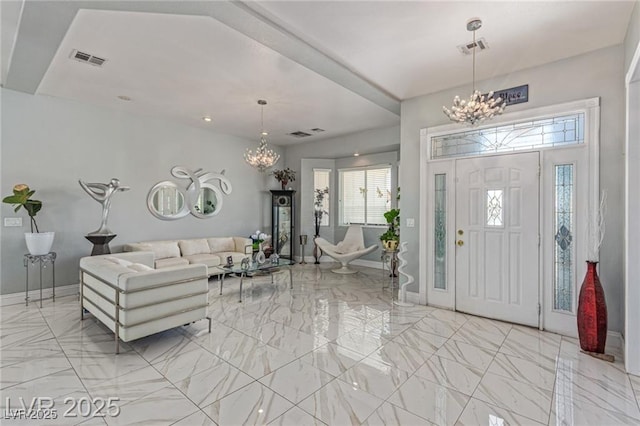 60 N Fogg St, Las Vegas, NV 89110 - foyer entrance with a chandelier and light marble finish floors