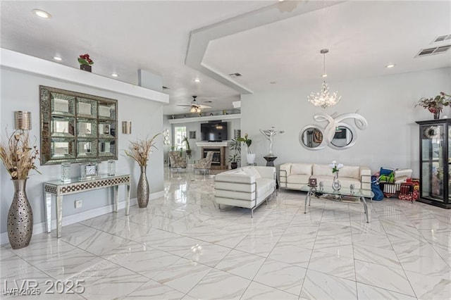 60 N Fogg St, Las Vegas, NV 89110 - living area with marble finish floors, ceiling fan, recessed lighting, a chandelier, and a glass covered fireplace