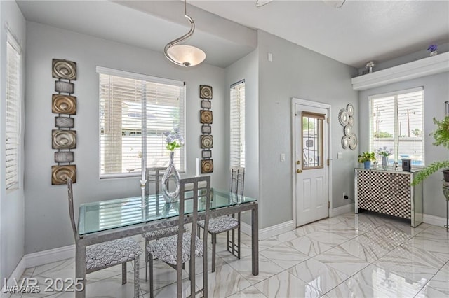 60 N Fogg St, Las Vegas, NV 89110 - dining area with plenty of natural light and light marble finish flooring