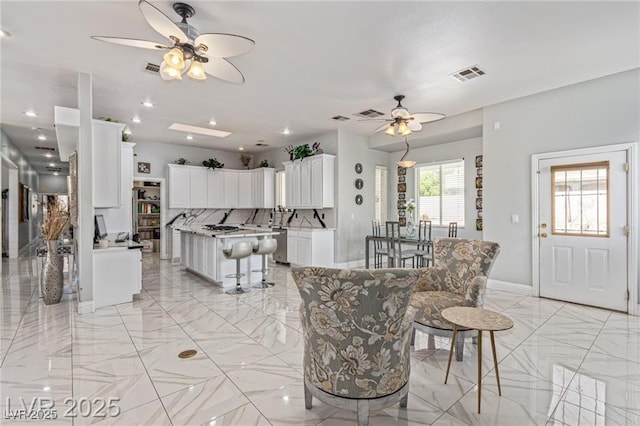 60 N Fogg St, Las Vegas, NV 89110 - dining space featuring a ceiling fan, light marble finish floors, and recessed lighting