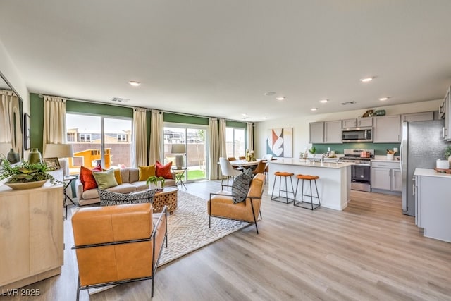 1321 Gable Falls Dr Unit 58, North Las Vegas, NV 89084 - living area featuring light wood finished floors and recessed lighting