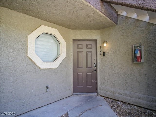 5042 S Rainbow Blvd Unit 103, Las Vegas, NV 89118 - view of exterior entry with stucco siding