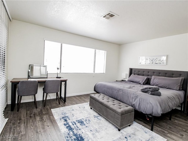 5042 S Rainbow Blvd Unit 103, Las Vegas, NV 89118 - bedroom featuring wood finished floors and baseboards