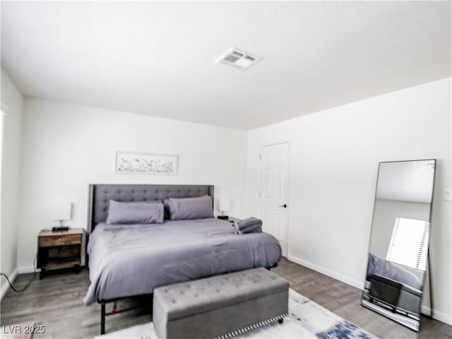 5042 S Rainbow Blvd Unit 103, Las Vegas, NV 89118 - bedroom featuring wood finished floors and baseboards