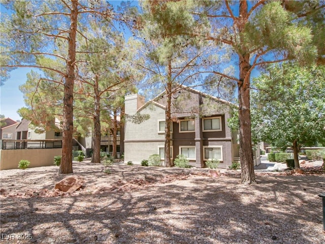 5042 S Rainbow Blvd Unit 103, Las Vegas, NV 89118 - view of front of house featuring a chimney