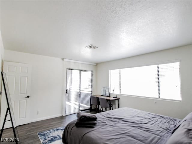5042 S Rainbow Blvd Unit 103, Las Vegas, NV 89118 - bedroom featuring wood finished floors and a textured ceiling