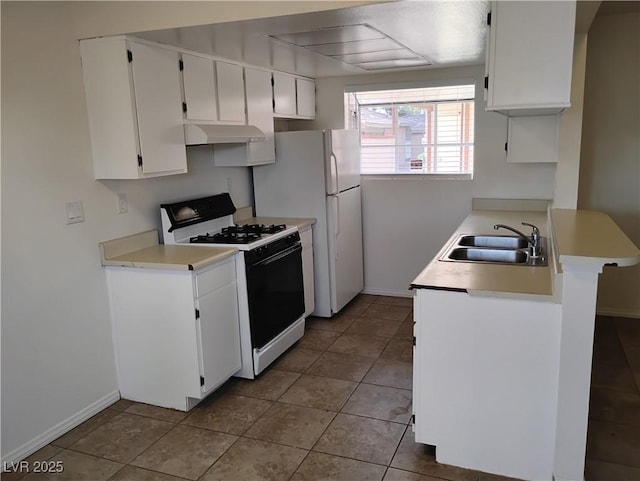 425 N Lamb Blvd Unit D, Las Vegas, NV 89110 - kitchen featuring gas range, tile patterned flooring, under cabinet range hood, white cabinets, and light countertops