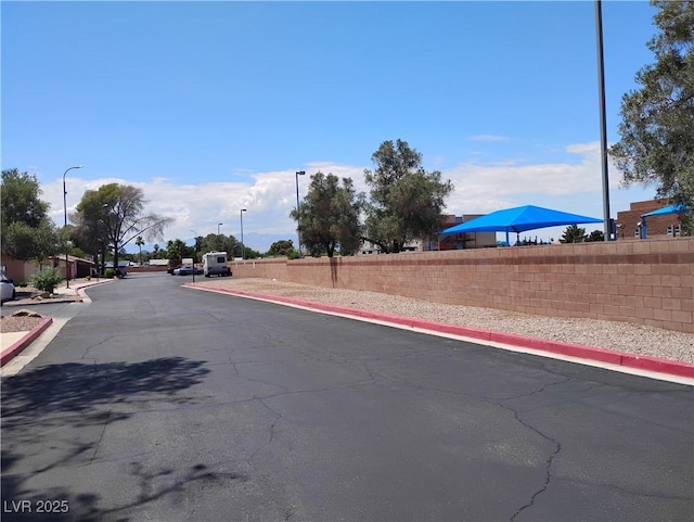 425 N Lamb Blvd Unit D, Las Vegas, NV 89110 - view of asphalt street featuring curbs, street lighting, and sidewalks