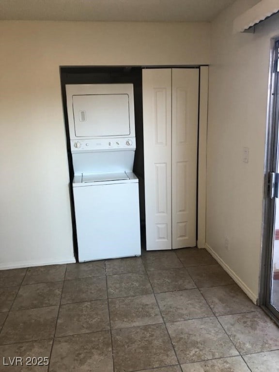 425 N Lamb Blvd Unit D, Las Vegas, NV 89110 - laundry area featuring stacked washer and clothes dryer and tile patterned floors